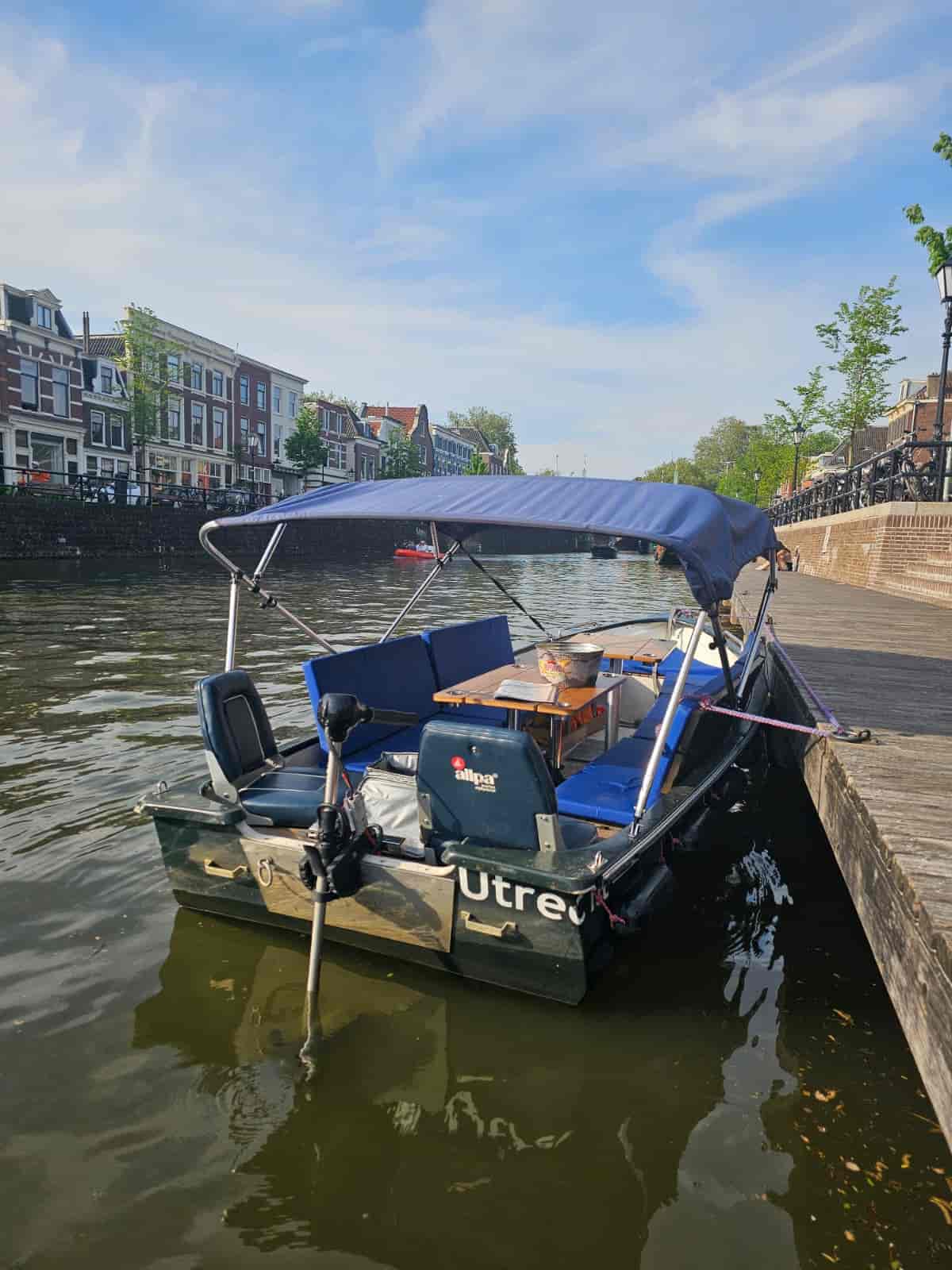 View of the boat with its cover up, seen from the quay